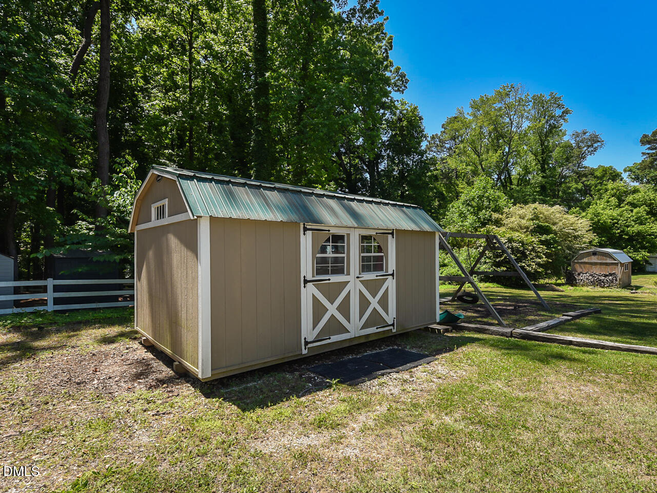 1703 St Patrick Drive Raleigh, NC 27603 - Photo 22 of 29 a view of a small house with wooden fence in front of it