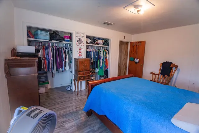 a bedroom with a bed and a bookshelf