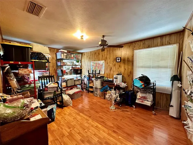 a living room filled with furniture and a flat screen tv