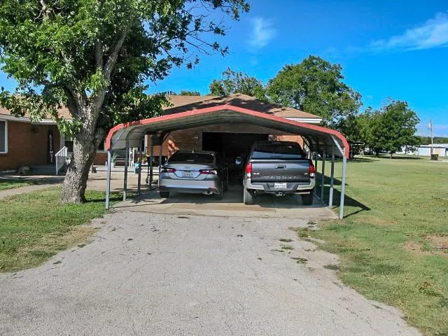 a view of street with parked cars