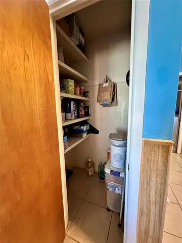 a bathroom with a toilet and a shower curtain