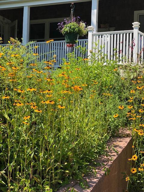 90 West Tisbury Road Edgartown, MA 02539 - Photo 12 of 46 a view of a house with a flower garden