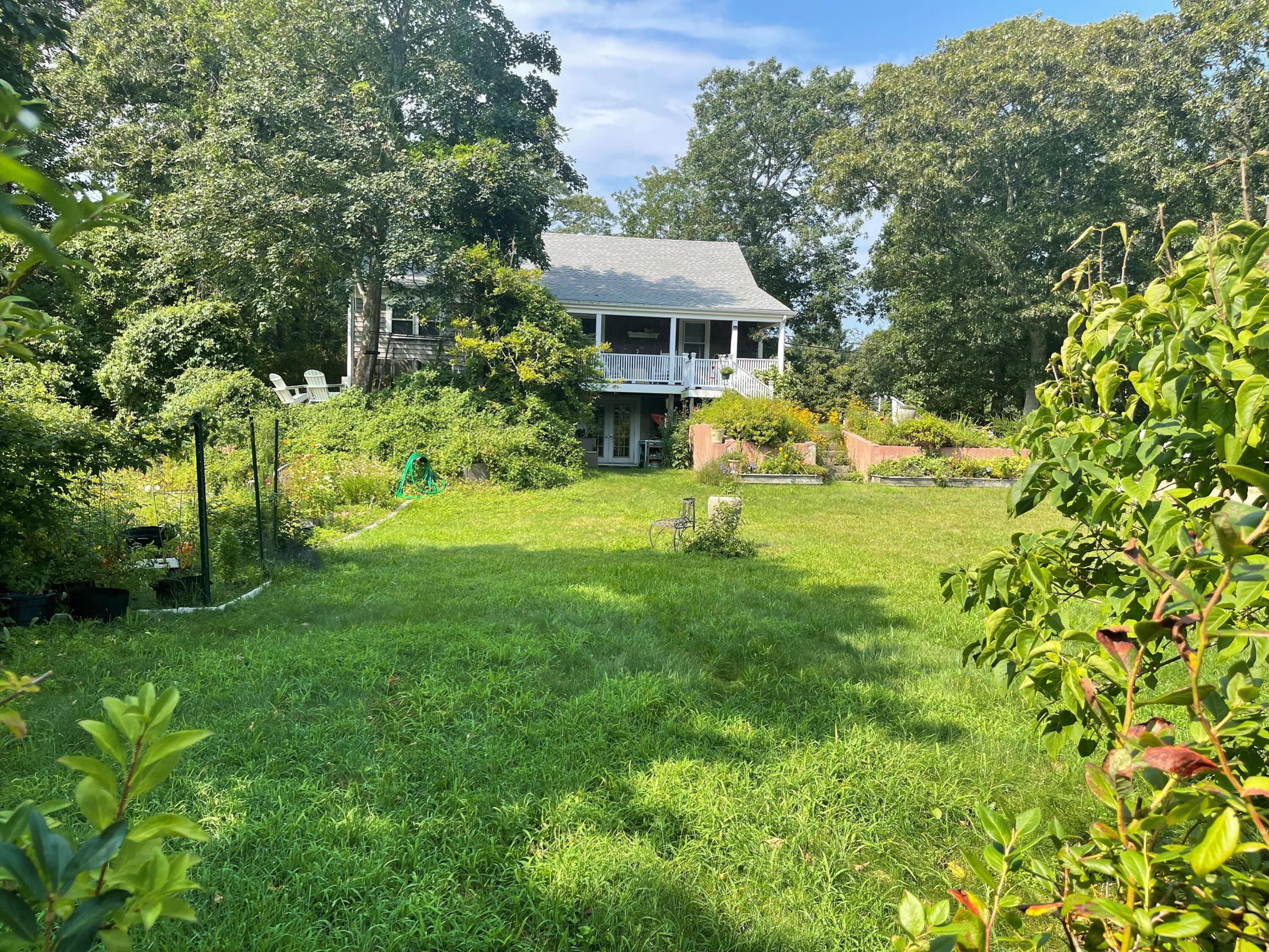 90 West Tisbury Road Edgartown, MA 02539 - Photo 14 of 46 a view of a house with a yard