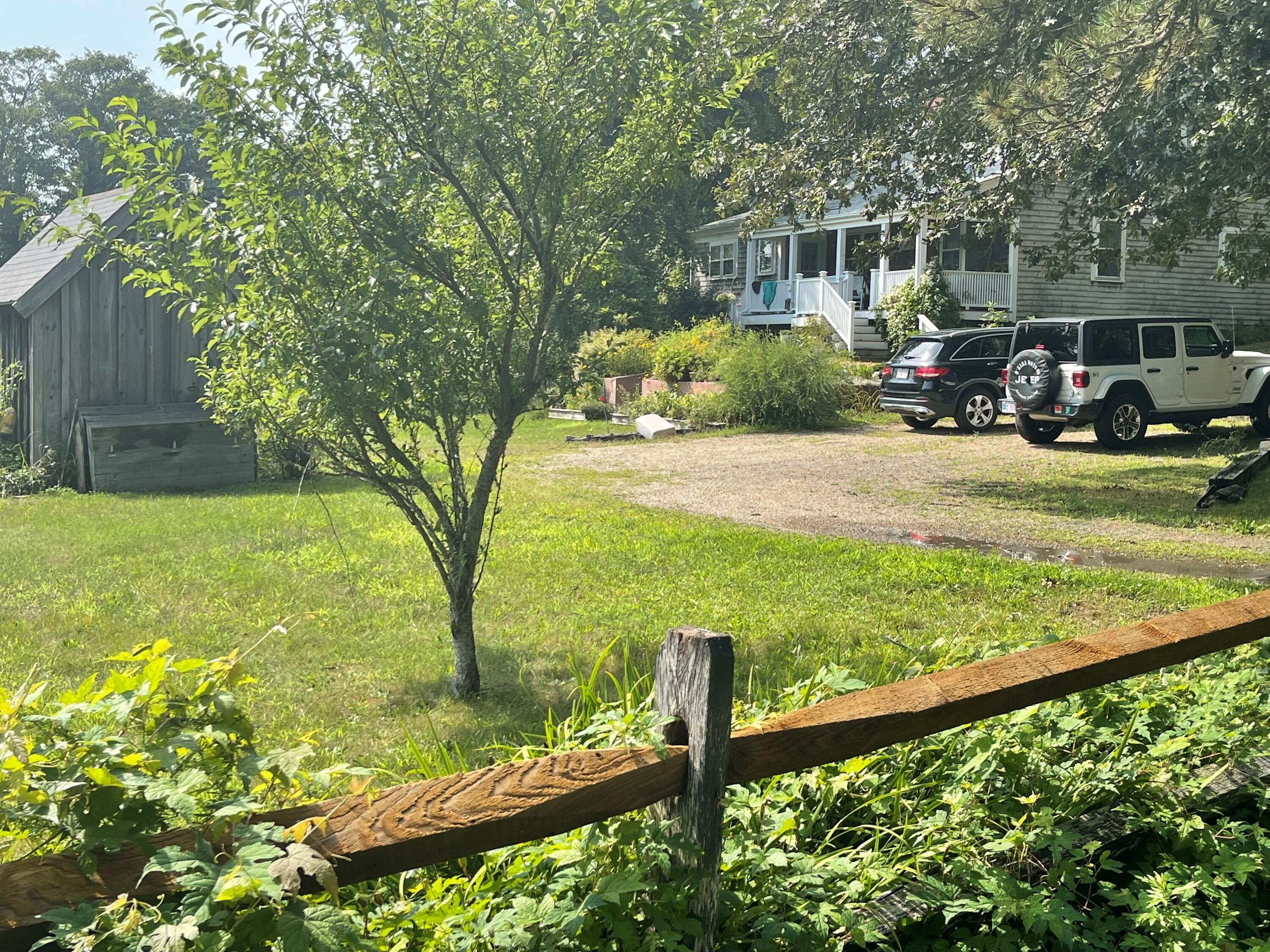 90 West Tisbury Road Edgartown, MA 02539 - Photo 16 of 46 a front view of a house with garden