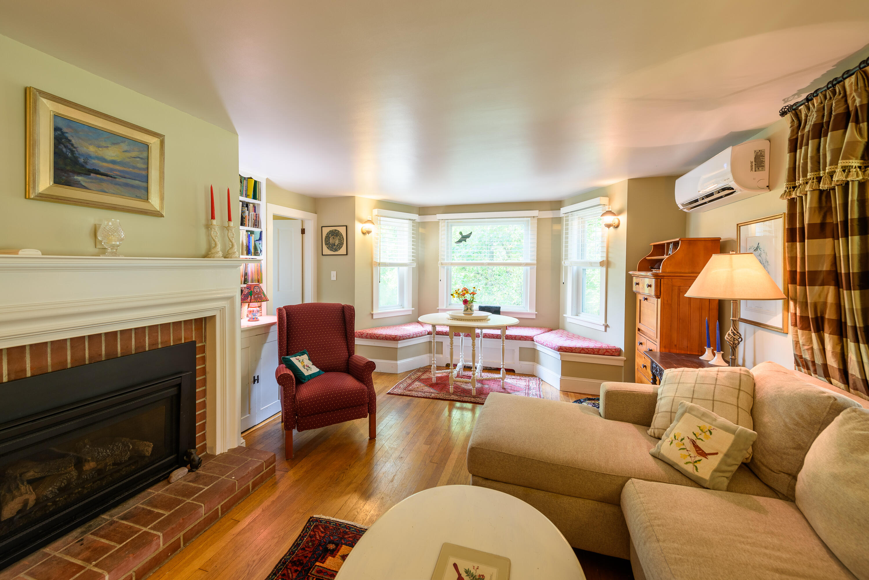 90 West Tisbury Road Edgartown, MA 02539 - Photo 26 of 46 a living room with furniture fireplace and a large window