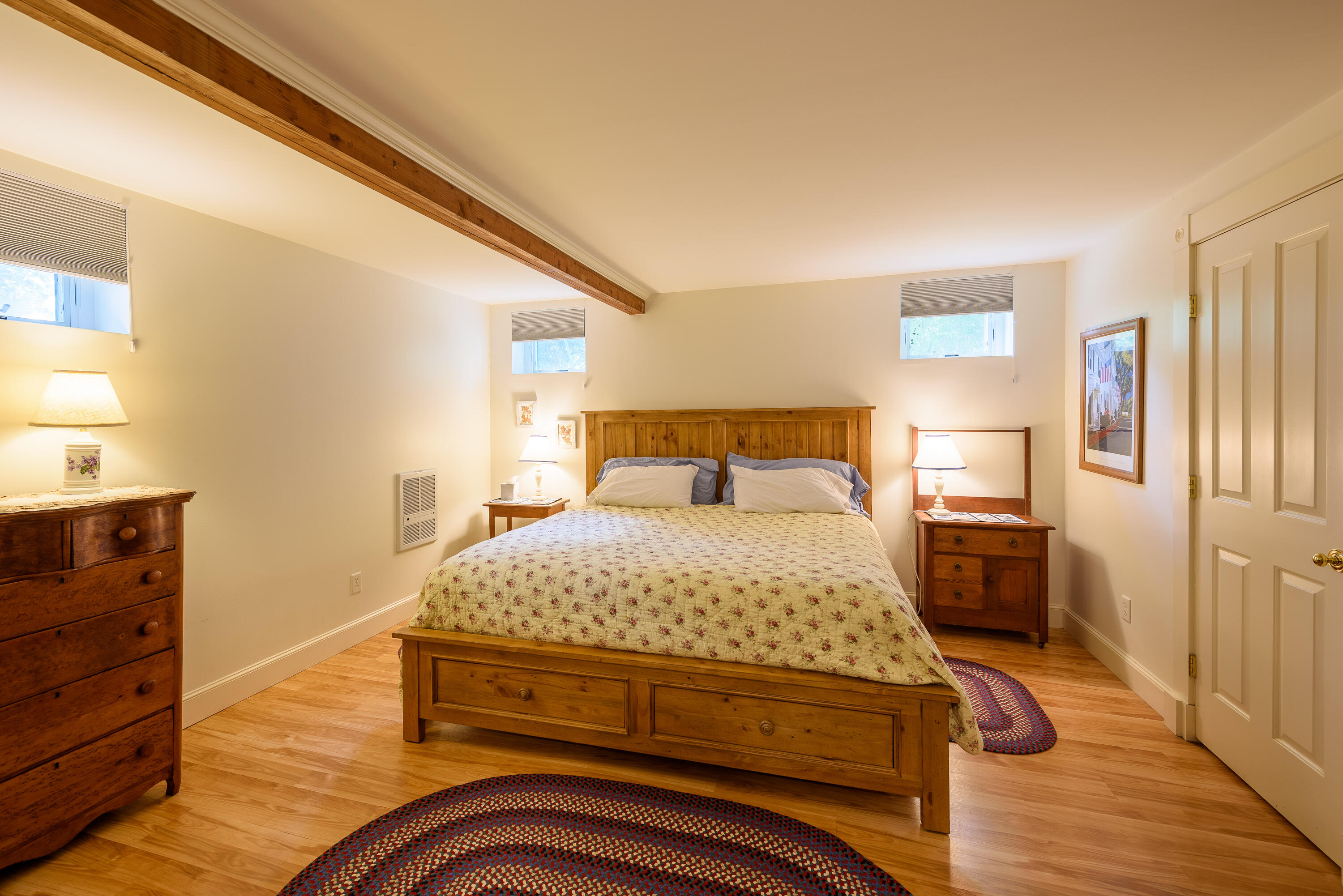 90 West Tisbury Road Edgartown, MA 02539 - Photo 35 of 46 a bedroom with a bed and wooden floor