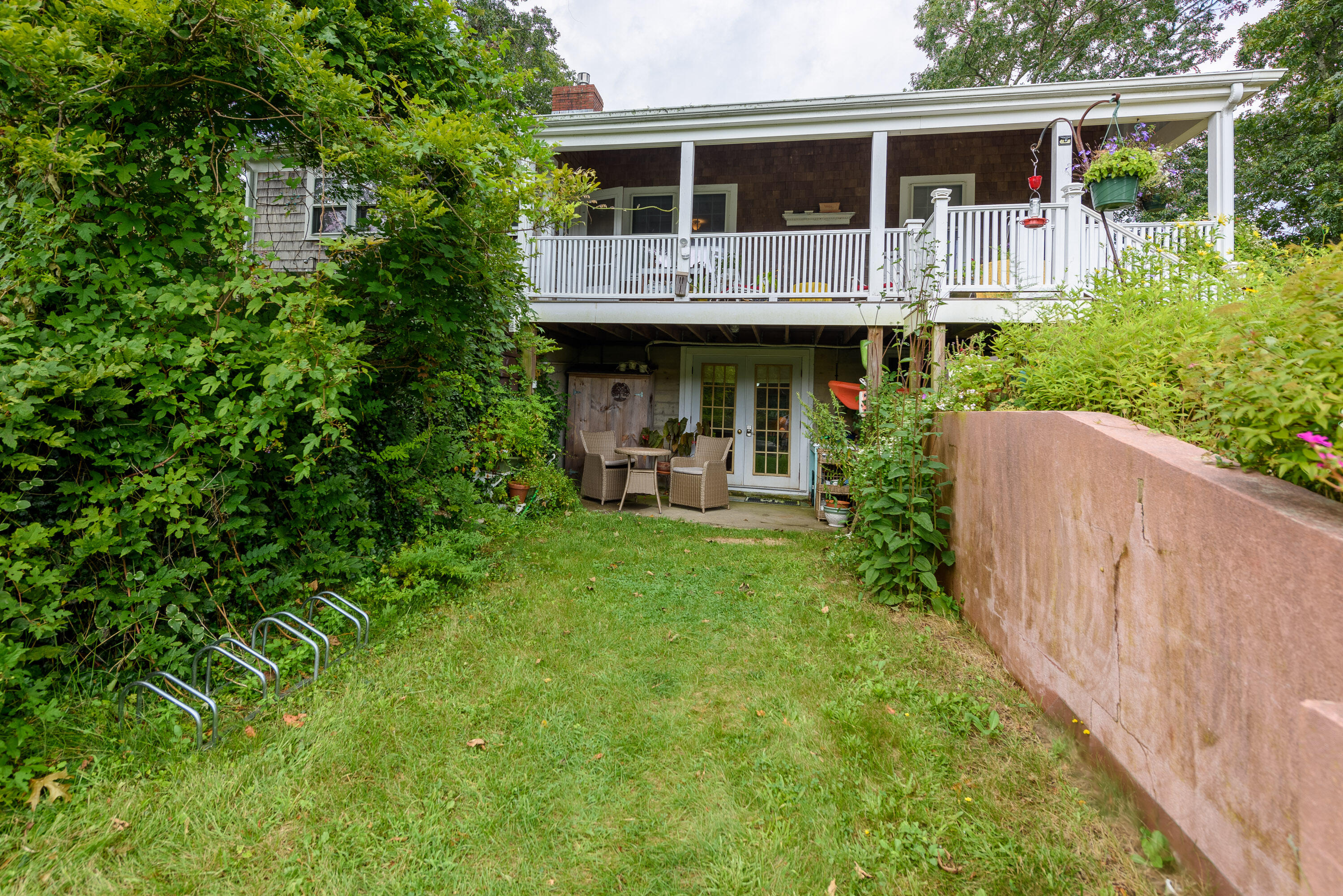 90 West Tisbury Road Edgartown, MA 02539 - Photo 39 of 46 a house view with a garden space