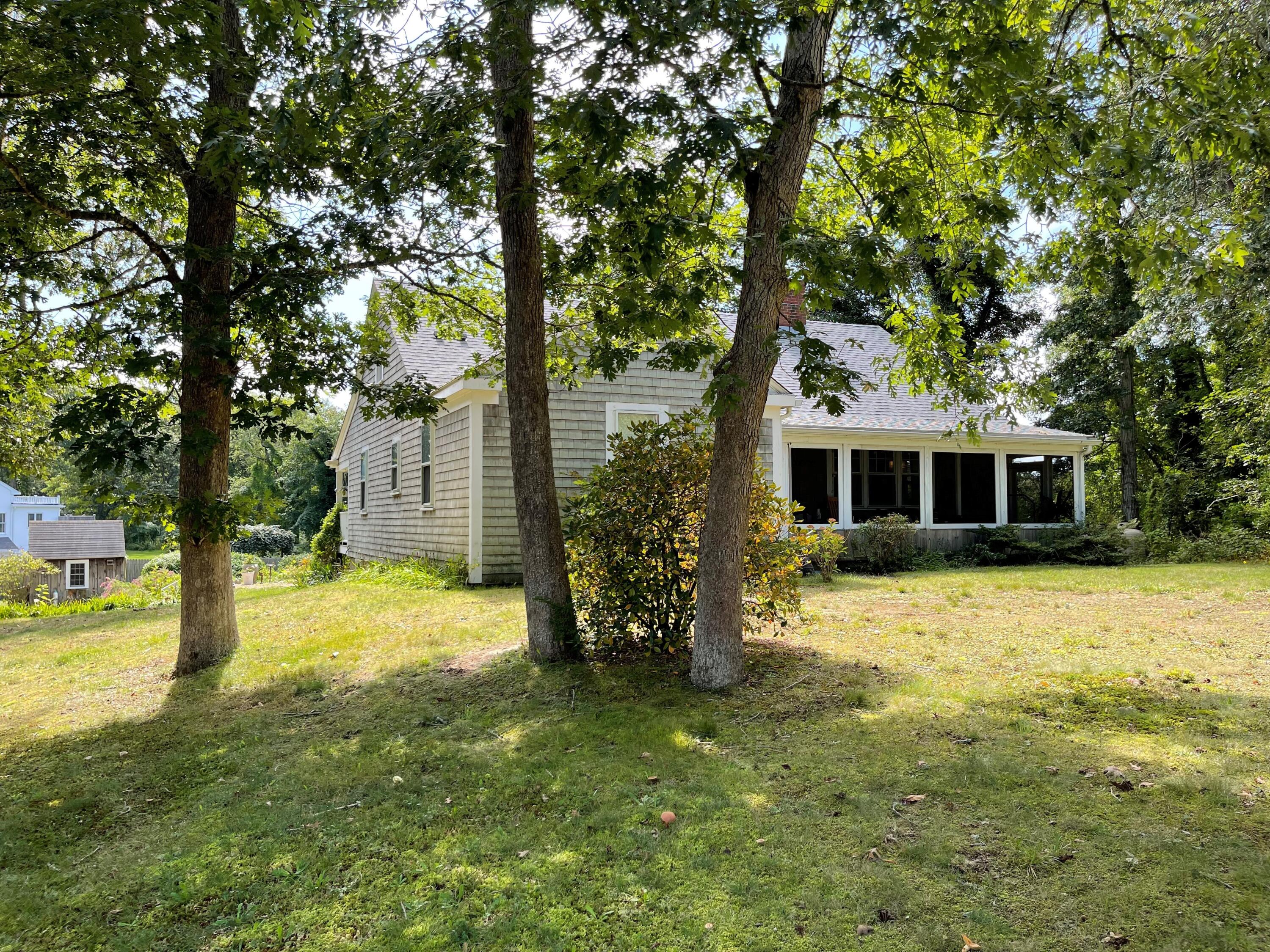 90 West Tisbury Road Edgartown, MA 02539 - Photo 46 of 46 a yellow house in middle of the forest