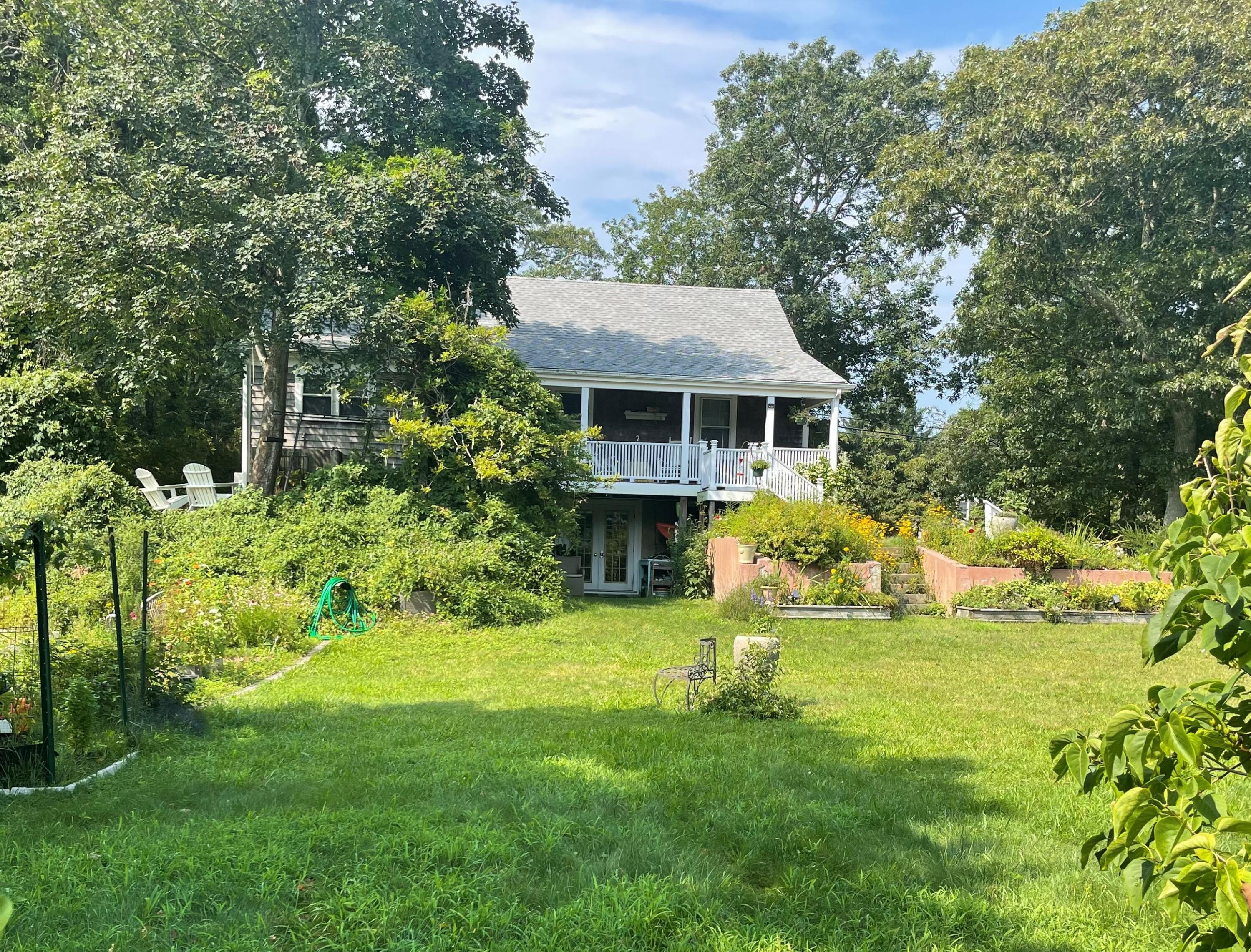 90 West Tisbury Road Edgartown, MA 02539 - Photo 6 of 46 a view of house with backyard and garden