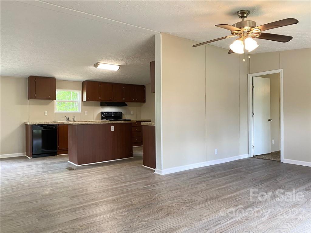 187 Mosley Road Blacksburg, SC 29702 - Photo 5 of 16 a kitchen with stainless steel appliances granite countertop a refrigerator and a sink