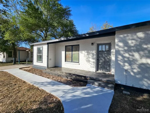 a house with trees in the background