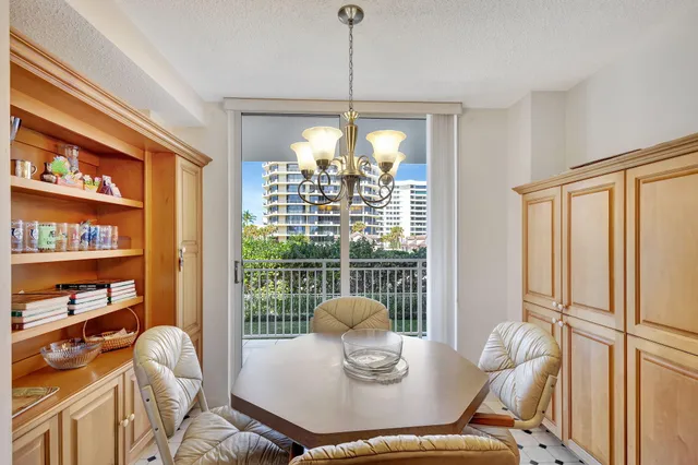 a bedroom with double bed and a chandelier