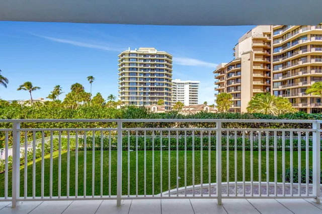 a view of a balcony with chairs
