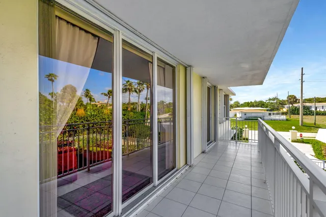 a view of balcony with furniture