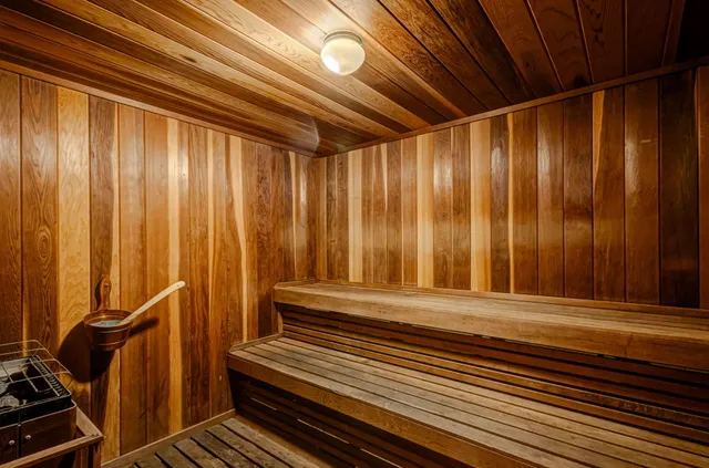 a front view of a house with a garden and patio