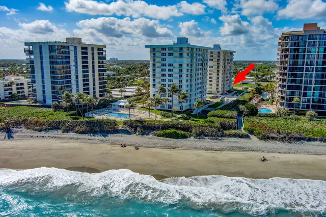 a view of an swimming pool and outdoor seating