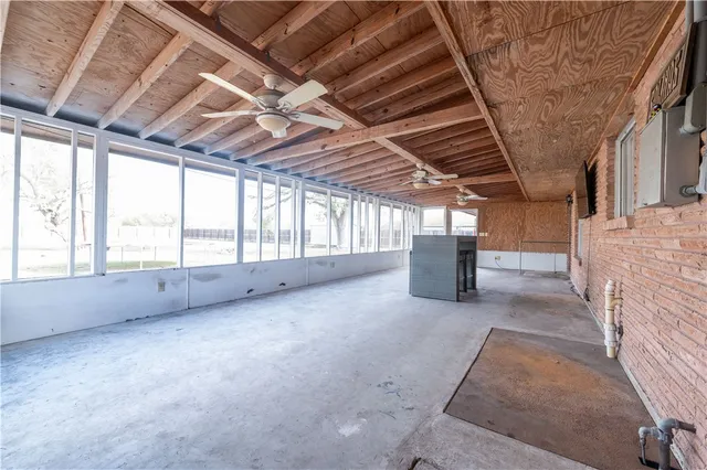 a view of a room with windows