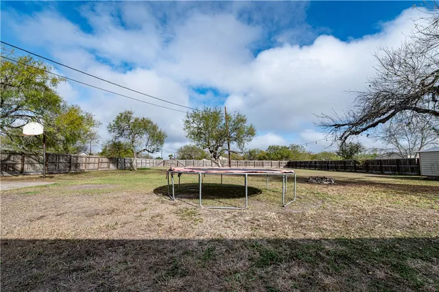 a view of a lake with a house in the background
