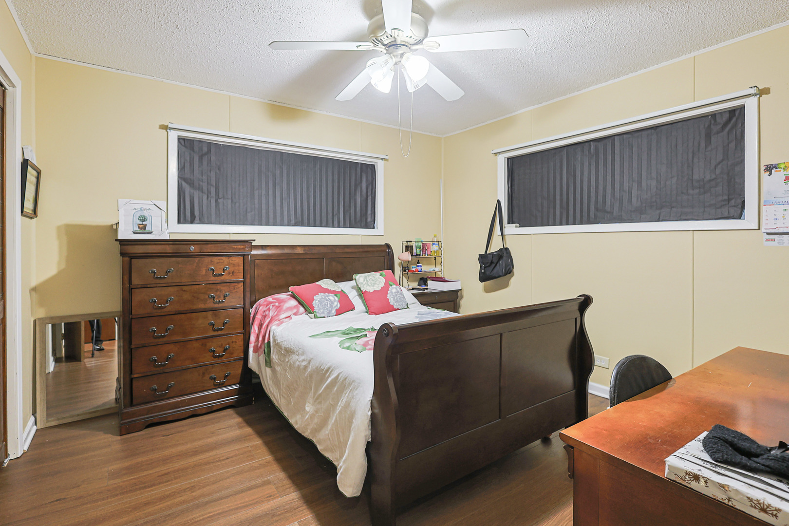 372 Nancy Lane Wheeling, IL 60090 - Photo 11 of 28 a bedroom with a bed and a dresser