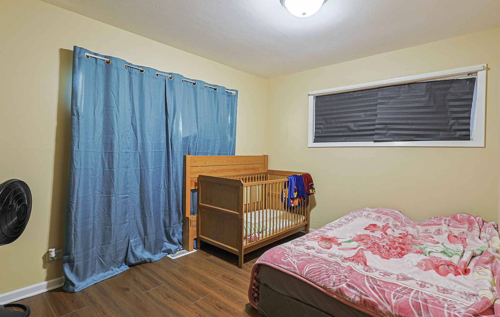 372 Nancy Lane Wheeling, IL 60090 - Photo 14 of 28 a bedroom with a bed and wooden floor