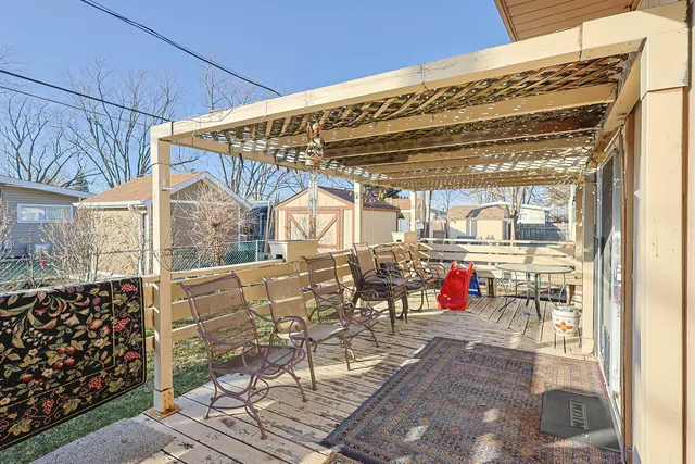 a view of a patio with table and chairs and potted plants