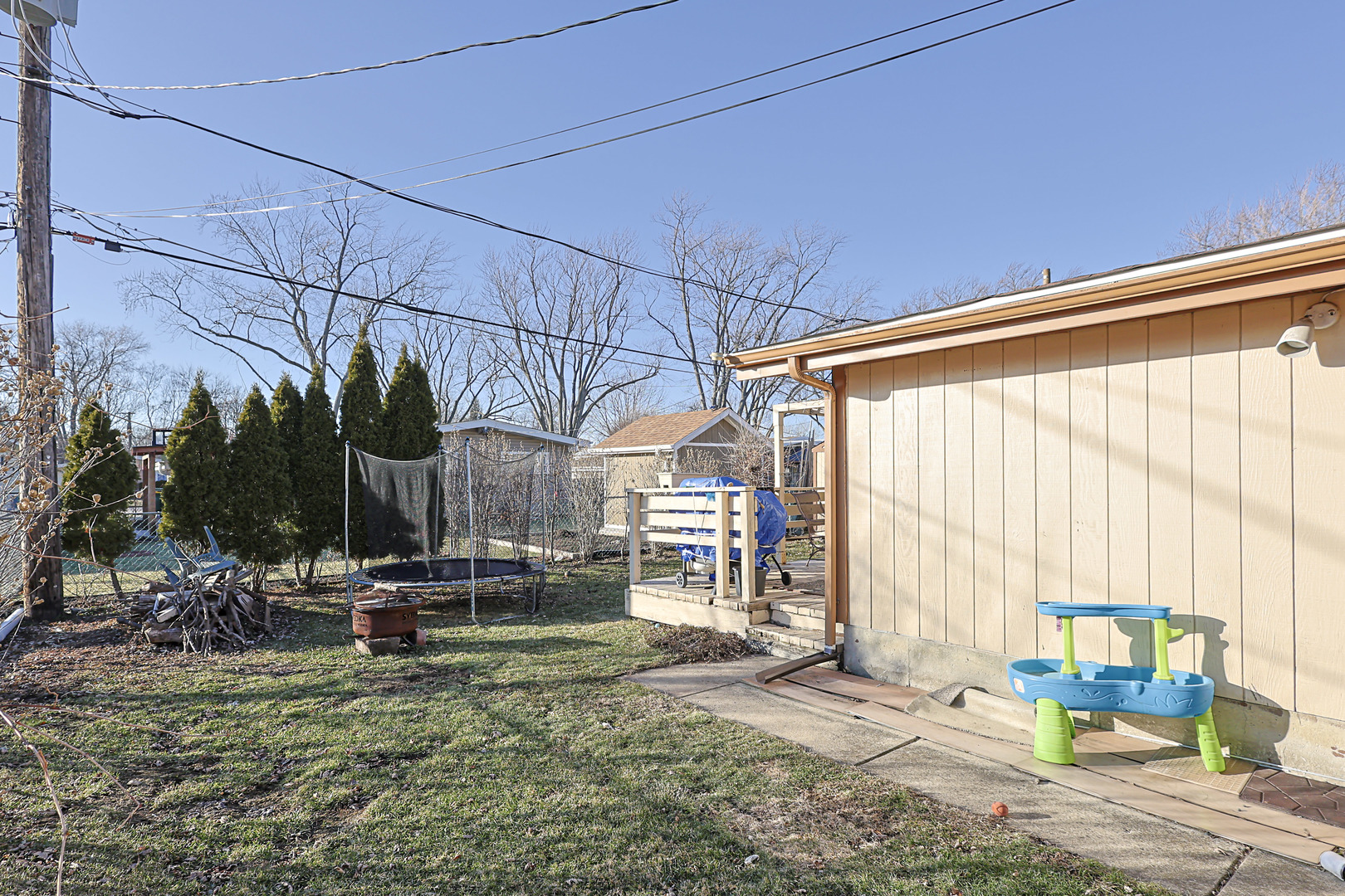 372 Nancy Lane Wheeling, IL 60090 - Photo 23 of 28 a backyard of a house with sofas fire pit and chairs