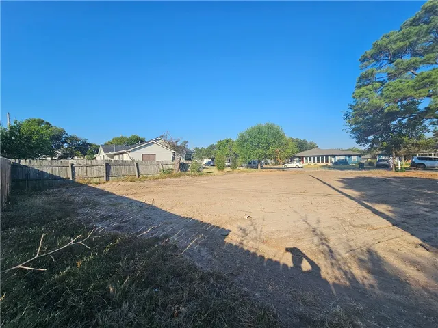 a view of an outdoor space and tennis court
