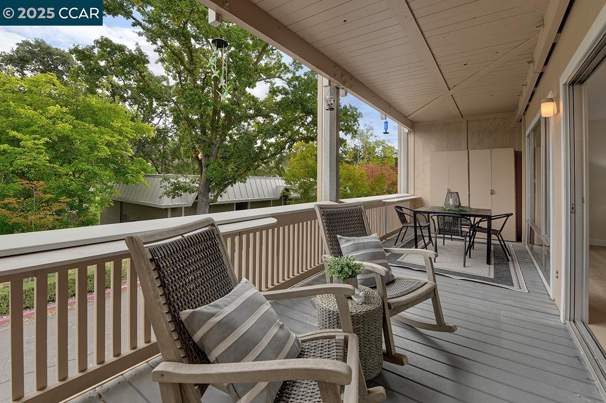 2940 Tice Creek Drive, Unit 6 Walnut Creek, CA 94595 - Photo 14 of 49 a view of balcony with furniture and wooden deck