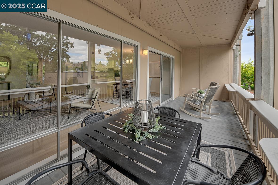 2940 Tice Creek Drive, Unit 6 Walnut Creek, CA 94595 - Photo 18 of 49 a view of a dining room with furniture wooden floor and chandelier