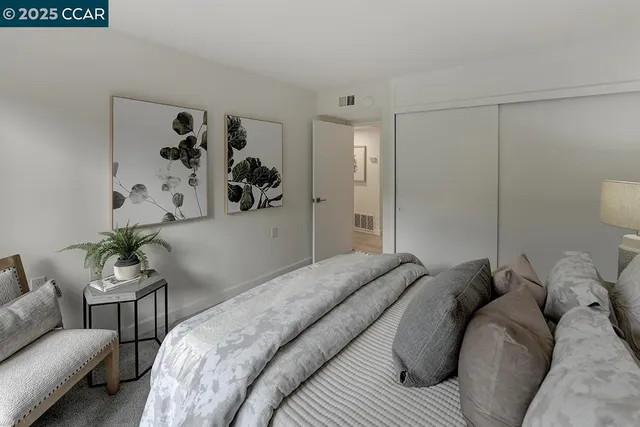 a bed room with a bed and a couch