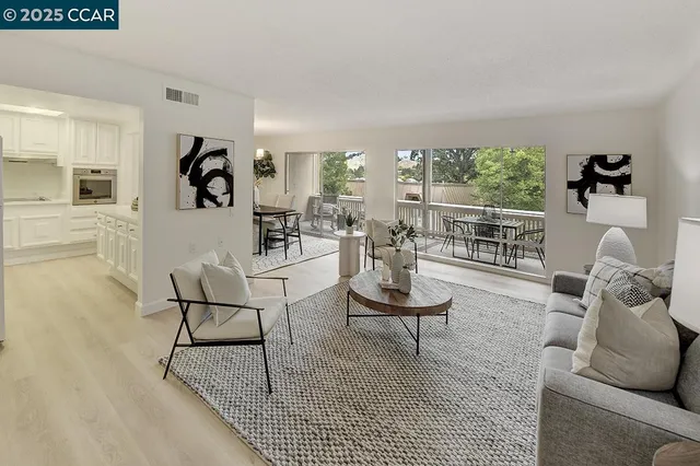 a living room with furniture and a table