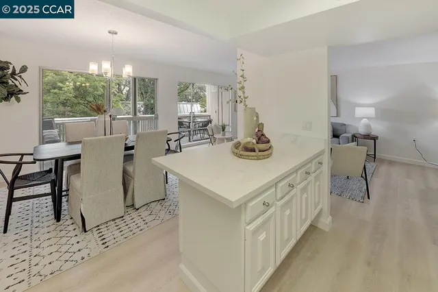 a view of living room filled with furniture and window