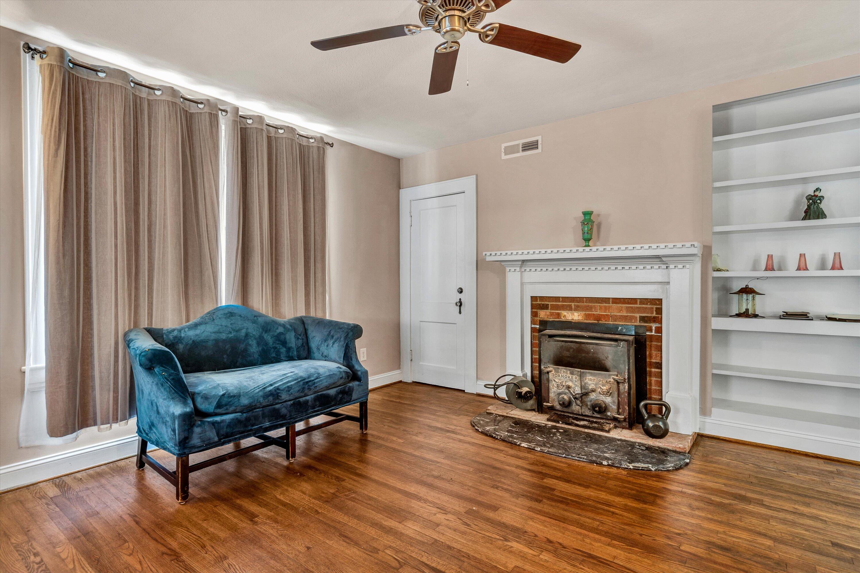 370 Rustic Ridge Road Stuart, VA 24171 - Photo 12 of 42 a living room with furniture and a fireplace