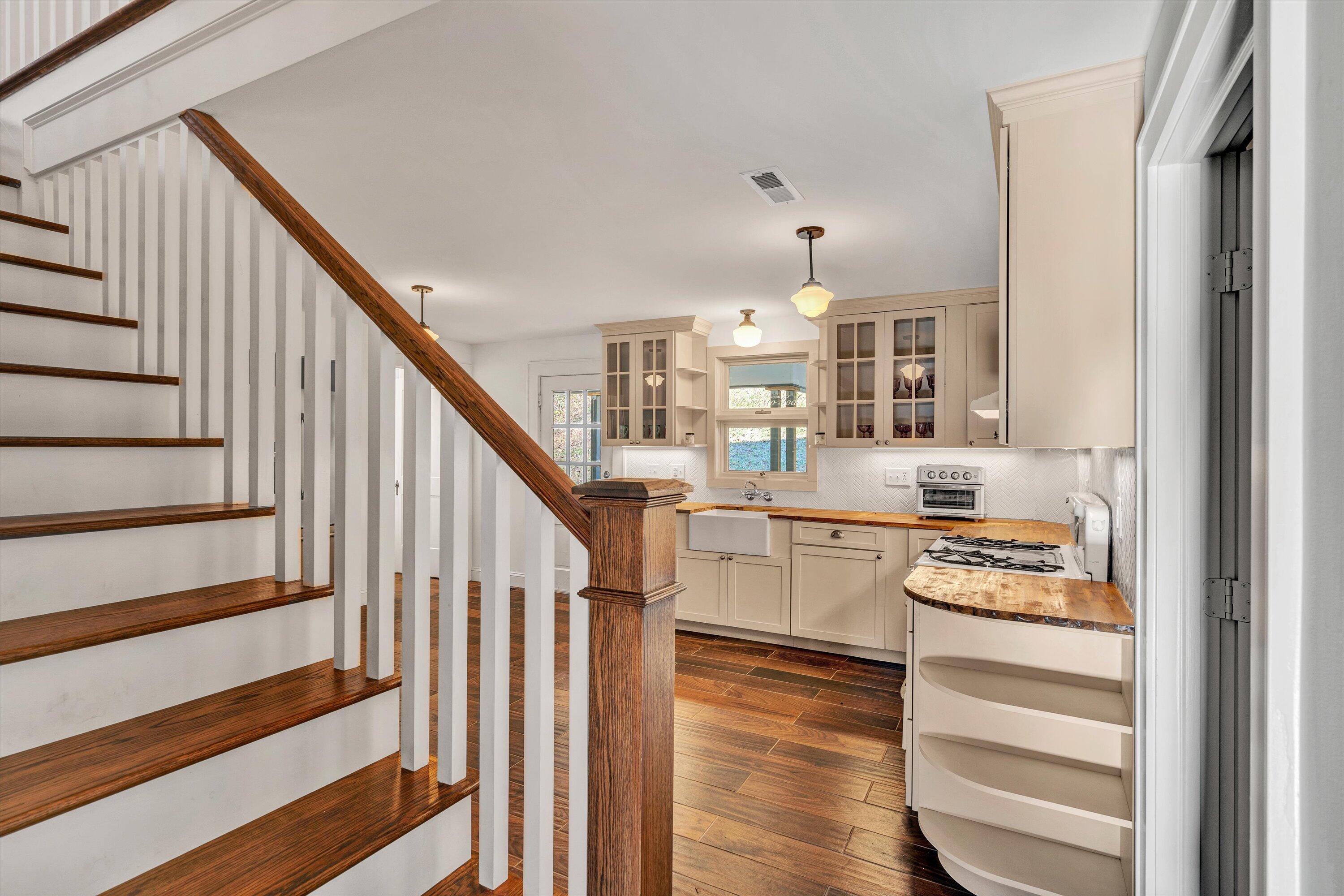 370 Rustic Ridge Road Stuart, VA 24171 - Photo 16 of 42 a kitchen with white cabinets and white appliances