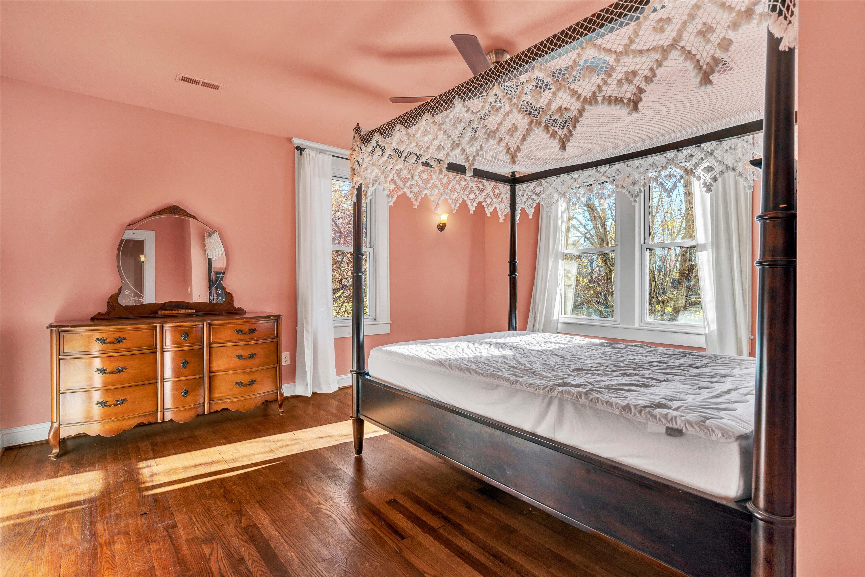 370 Rustic Ridge Road Stuart, VA 24171 - Photo 18 of 42 a bedroom with a bed and wooden floor