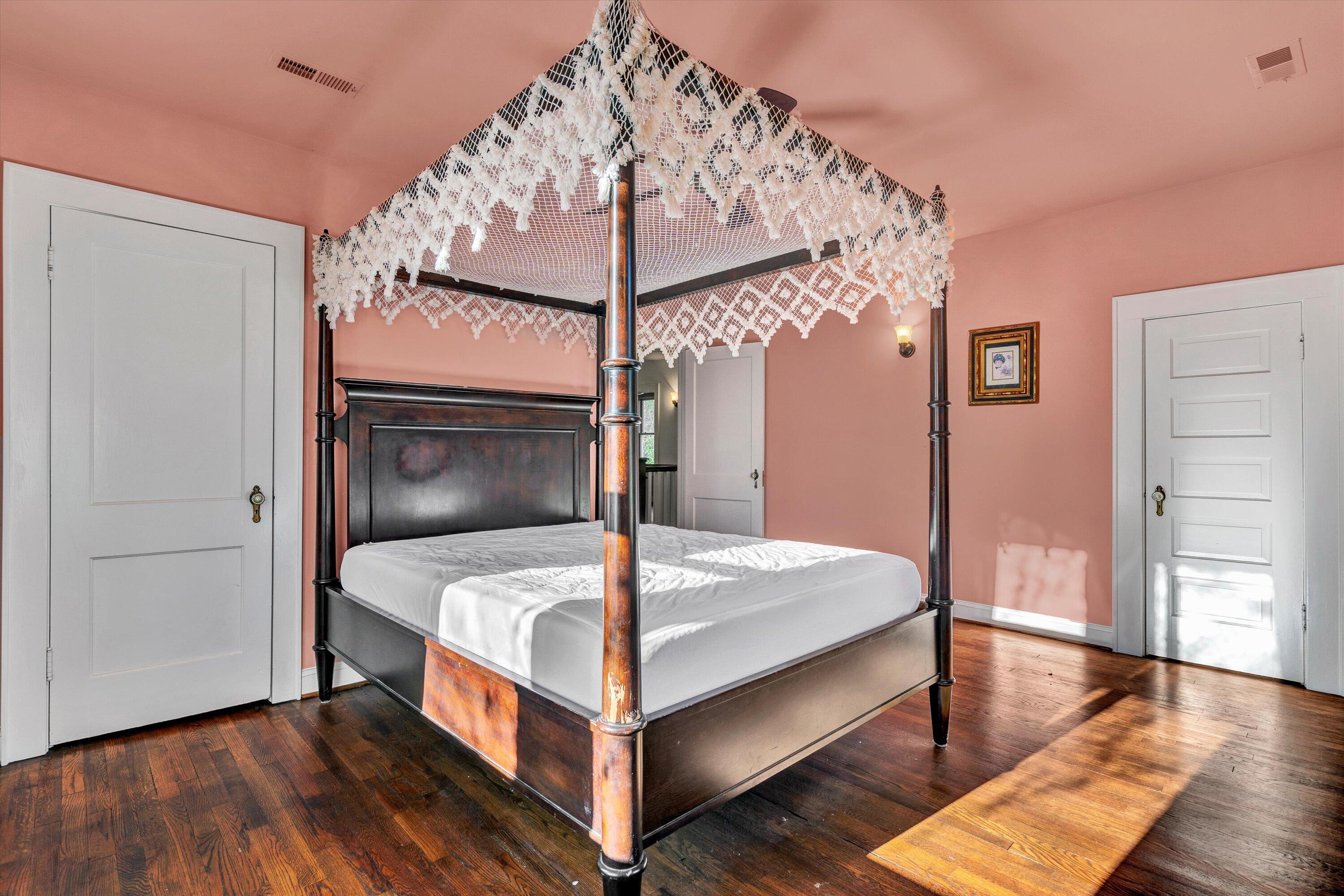 370 Rustic Ridge Road Stuart, VA 24171 - Photo 19 of 42 a bedroom with a bed and a chandelier