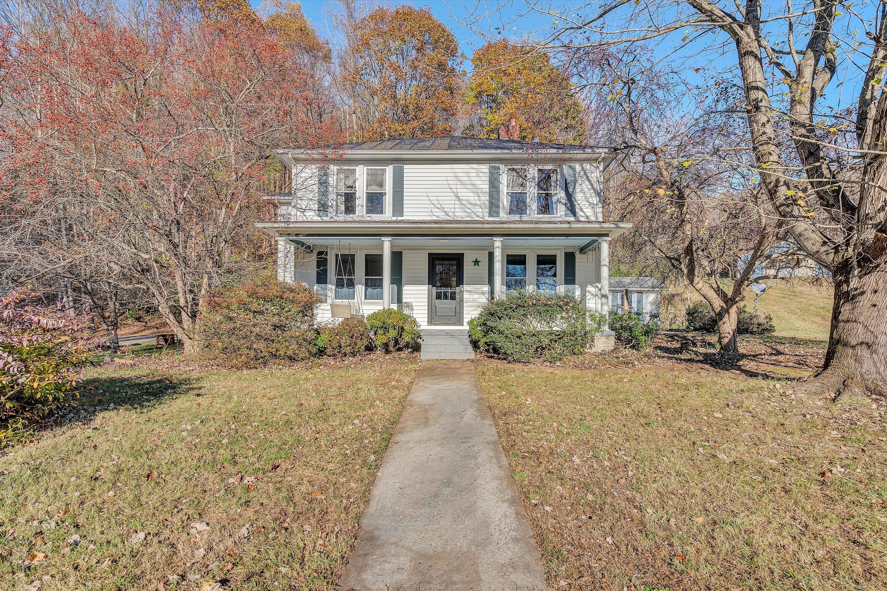 370 Rustic Ridge Road Stuart, VA 24171 - Photo 2 of 42 front view of house next to a yard
