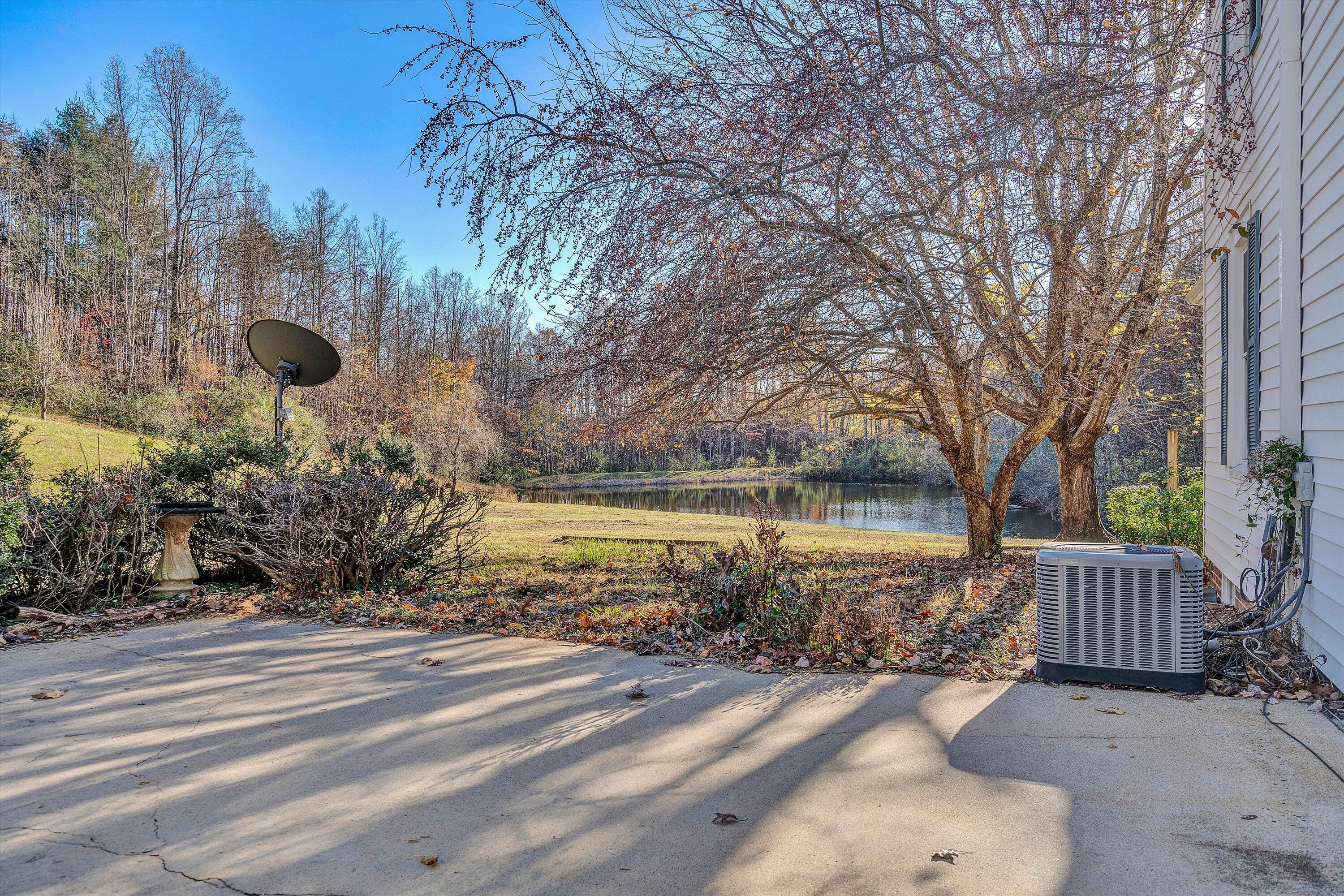 370 Rustic Ridge Road Stuart, VA 24171 - Photo 32 of 42 a view of a house with a yard