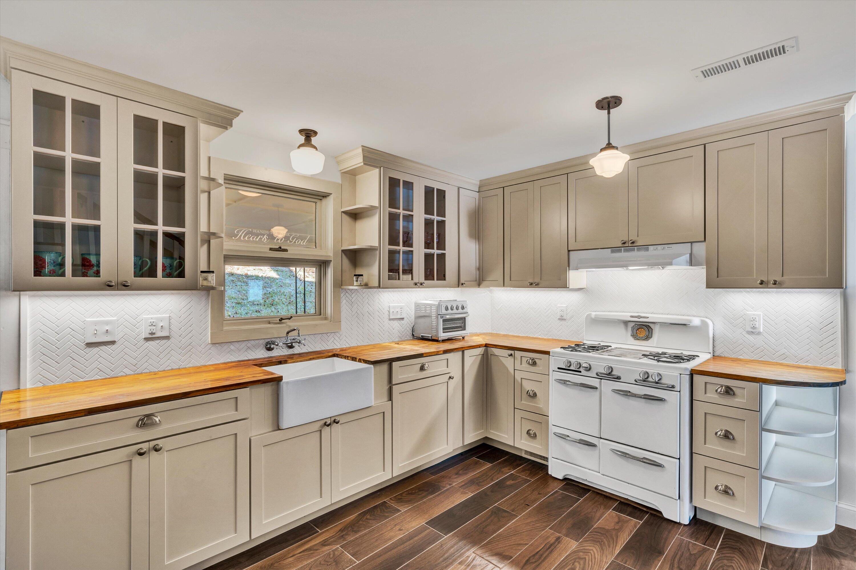 370 Rustic Ridge Road Stuart, VA 24171 - Photo 4 of 42 a kitchen with white cabinets and white appliances