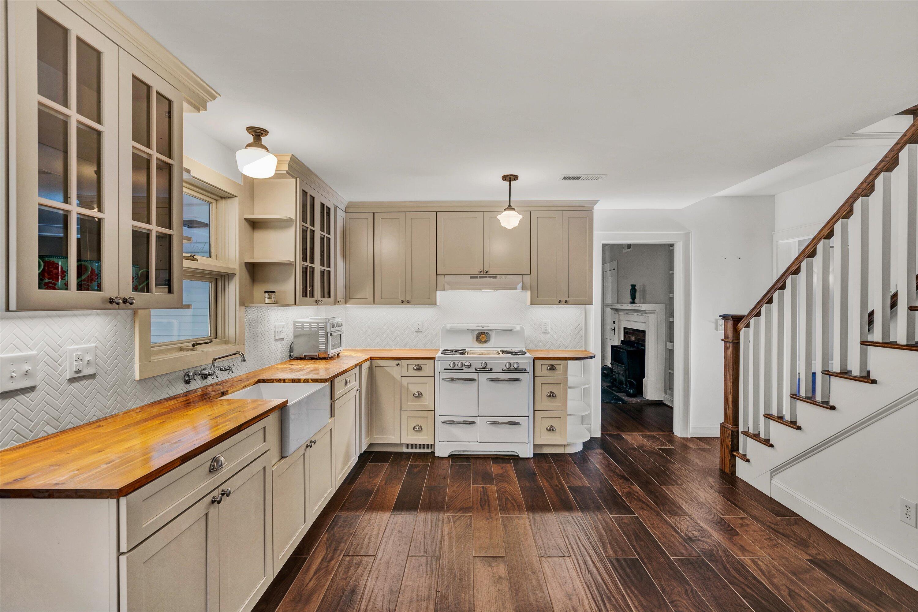 370 Rustic Ridge Road Stuart, VA 24171 - Photo 5 of 42 a kitchen with a sink and wooden floor