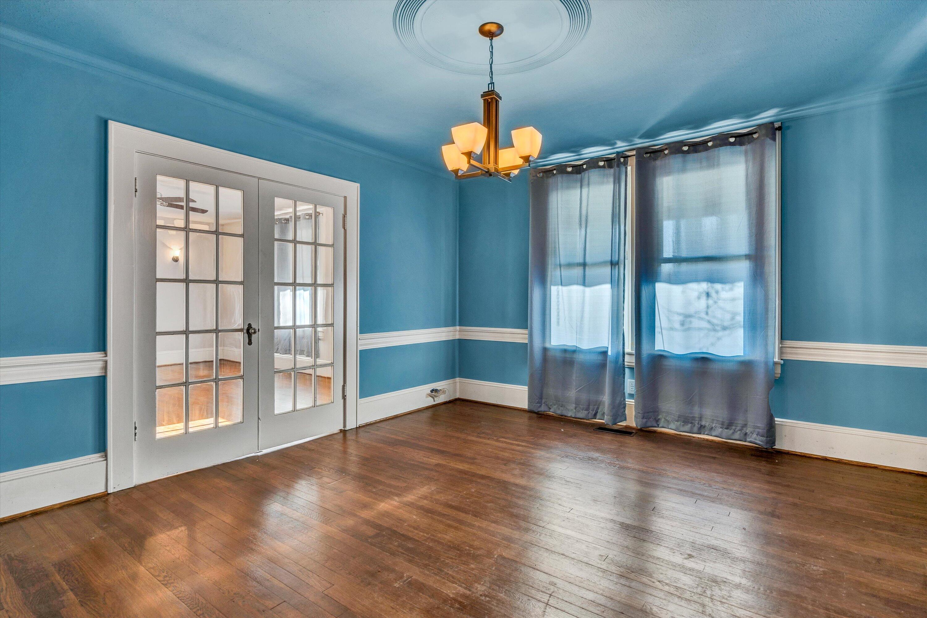 370 Rustic Ridge Road Stuart, VA 24171 - Photo 10 of 42 a view of an empty room with wooden floor and a window