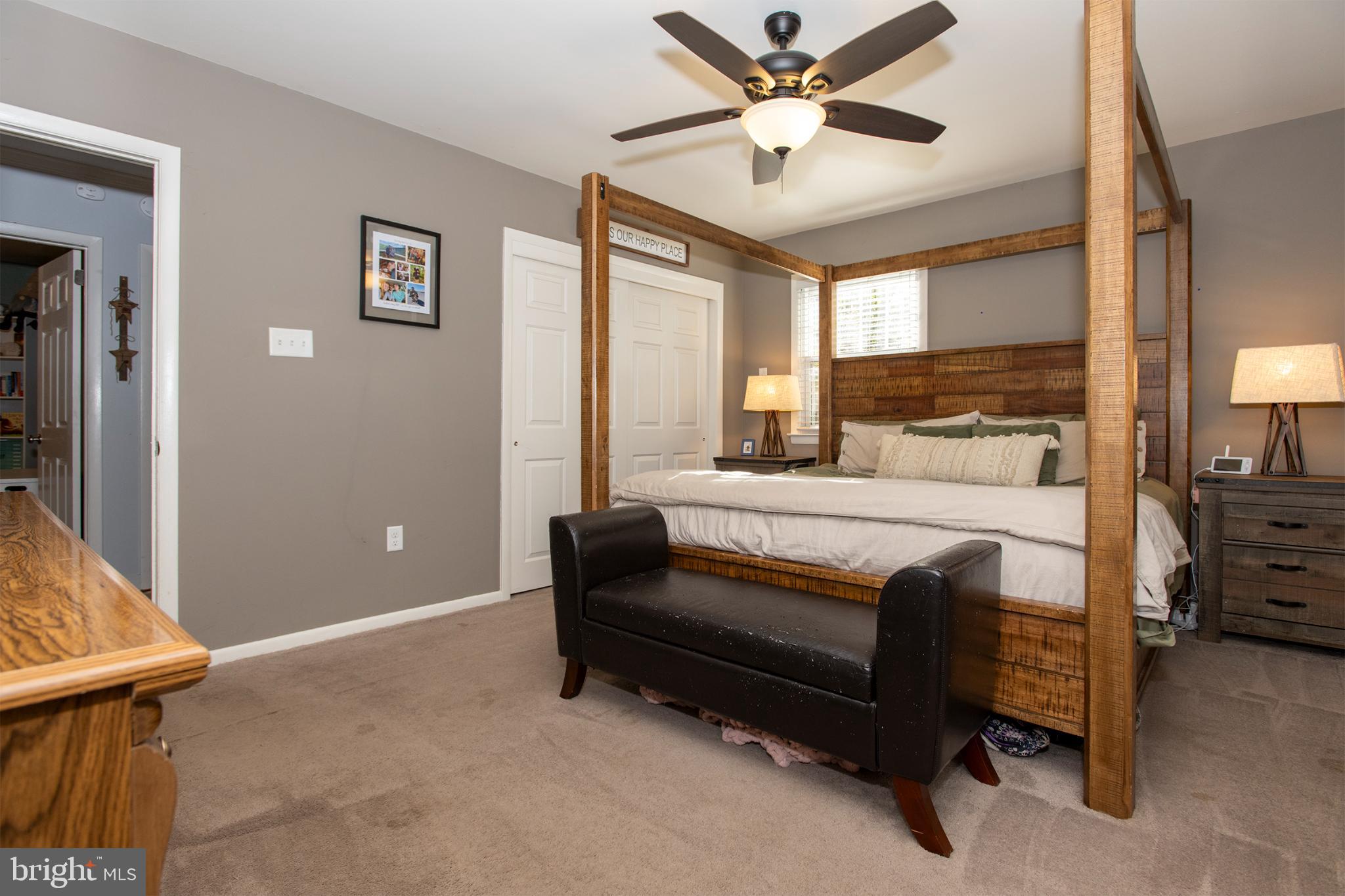 32 Ohio Trail Medford, NJ 08055 - Photo 11 of 25 a bedroom with a bed and a chandelier