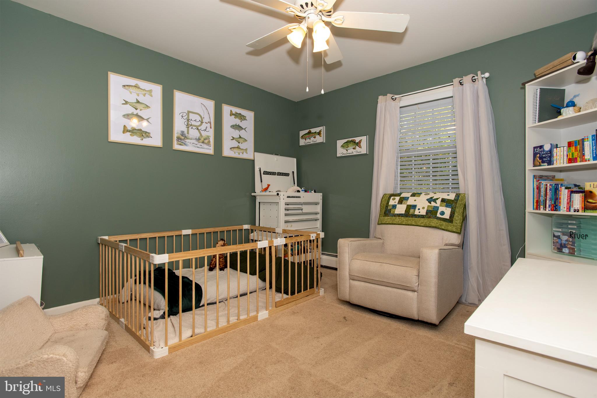 32 Ohio Trail Medford, NJ 08055 - Photo 13 of 25 a living room with furniture and a baby crib