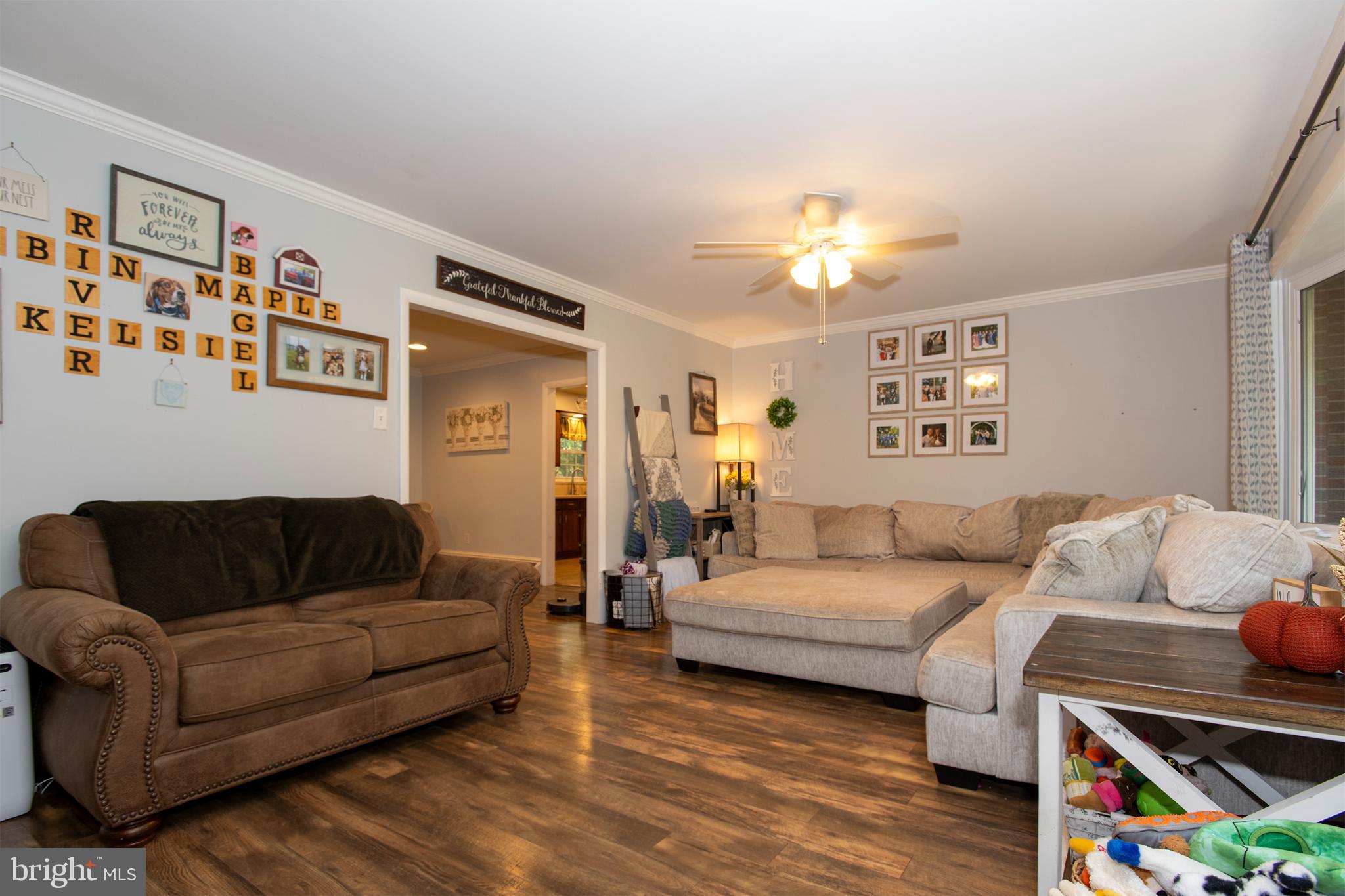 32 Ohio Trail Medford, NJ 08055 - Photo 3 of 25 a living room with furniture and a baby crib