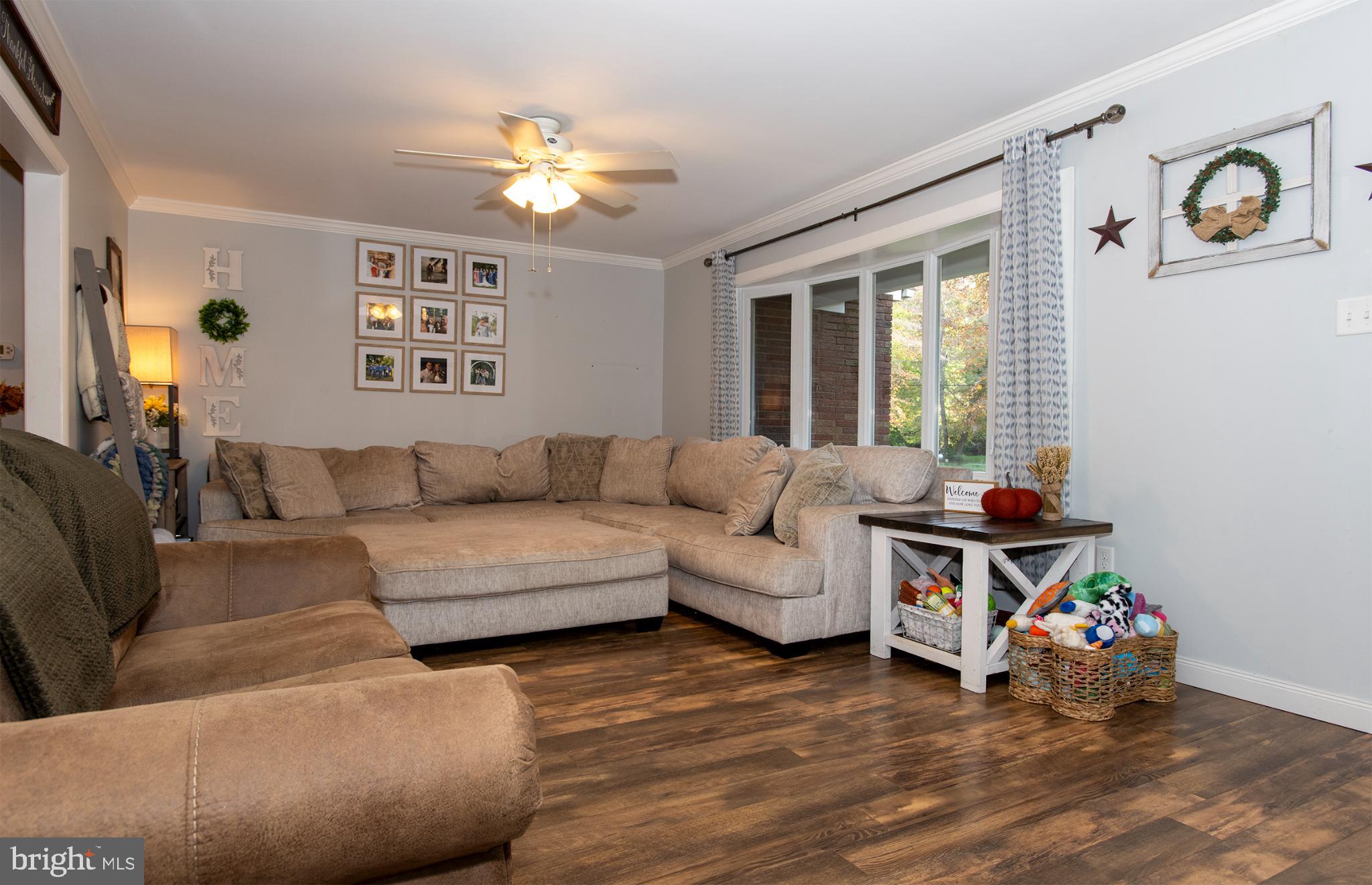 32 Ohio Trail Medford, NJ 08055 - Photo 4 of 25 a living room with furniture and a chandelier
