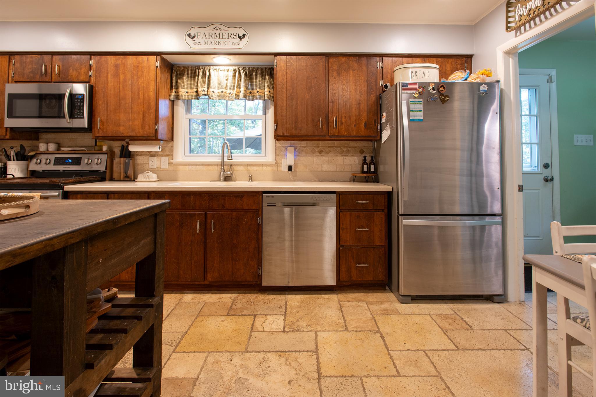 32 Ohio Trail Medford, NJ 08055 - Photo 8 of 25 a kitchen with stainless steel appliances granite countertop a refrigerator a stove a sink and a microwave
