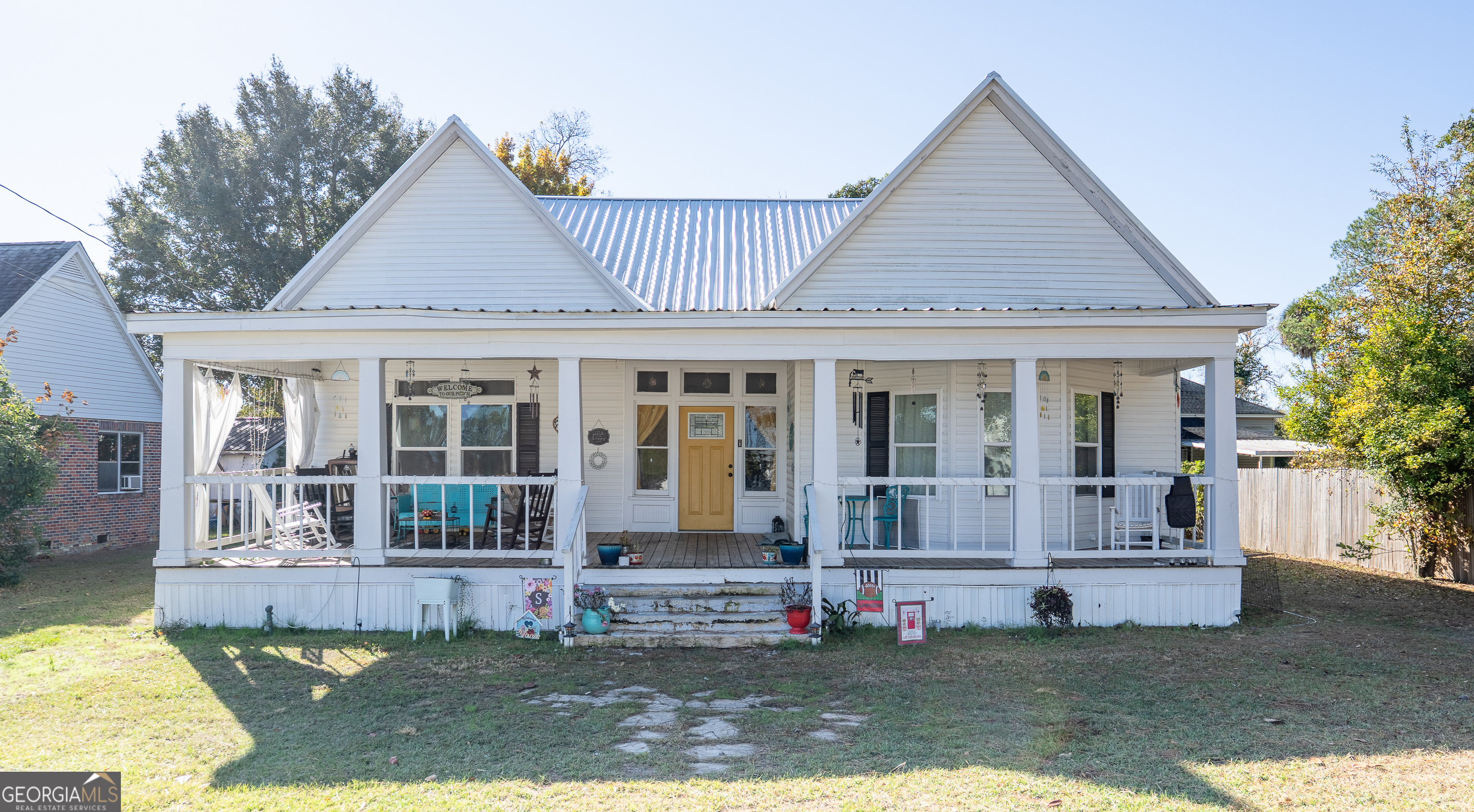 a front view of a house with a yard