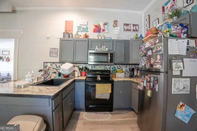 a kitchen with a stove and a refrigerator