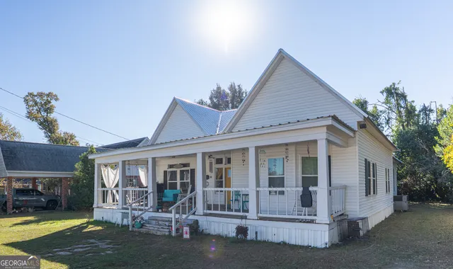 a front view of a house with a yard outdoor seating and yard