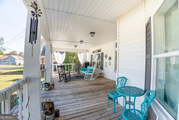 a view of a living room and balcony